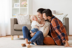 happy family with baby having fun at home